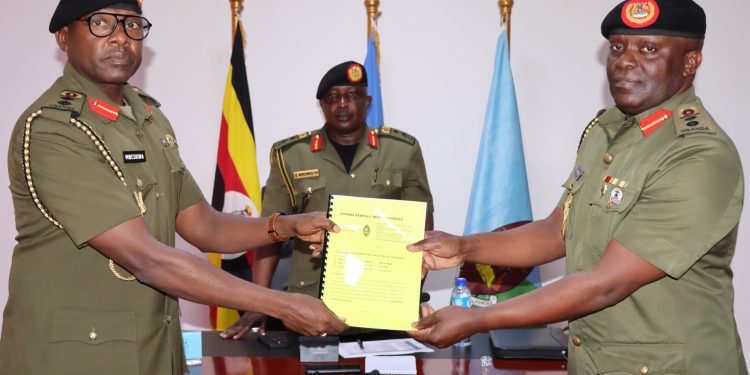 Col-Naboth-Mwesigwa-L-handingover-instruments-of-office-to-Col-Paddy-Ankuda