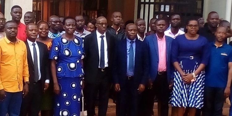 Career Teachers pose for a memorable group picture with the PS in blue kitengi