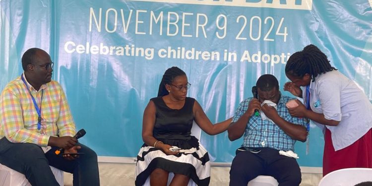 Two adopted children in the middle break down in tears as they share their story of abandonment: Photo by Kenneth Lukwago