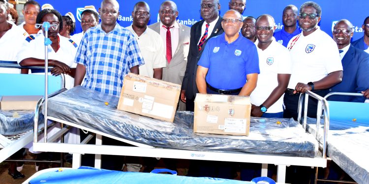 Adjumani District Health Officer, Dominic Drametu, Moyo District chairman William Anyama, Deputy RDC Emmanuel Okware and Mr Andrew Ocen the district CAO together with the Stanbic Bank delegation