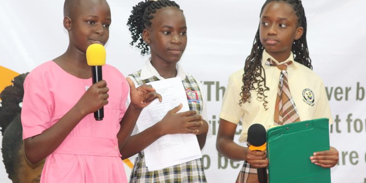 Children making a presentation at the World Children's Day Celebrations at Golf Course Hotel, Kampala ,Uganda. Courtesy Photo.