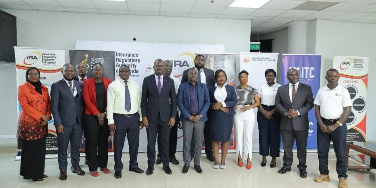 Group Photo after the launch at the insurance tower in Kampala