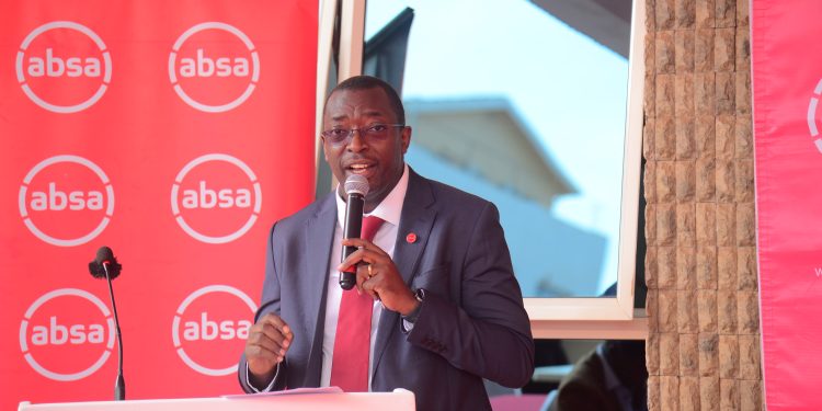 Absa Bank Uganda Executive Director and Chief Finance Officer Michael Segwaya speaking at the event