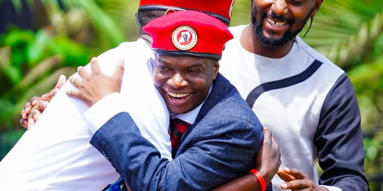 MP Muhammad Ssegirinya (Deceased) hugging NUP President Robert Kyagulanyi as the party's Secretay General Lewis Rubongoya looks on. Courtesy photo.