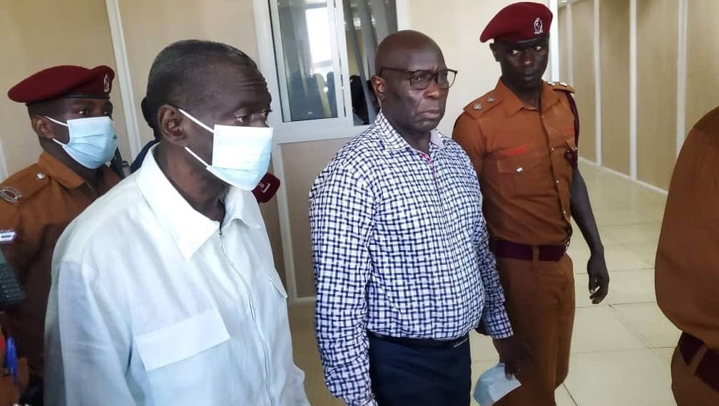 Col. Dr Kizza Besigye (in a mask) and Hajj Obedi Lutale. Courtesy Photo