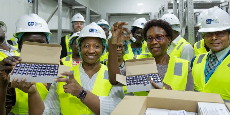 Dr. Ruth Aceng (second right) showing off the vaccines.
