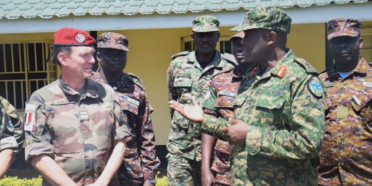 Brig.Gen_.Paul-Muwonge-sharing-a-light-moment-with-the-French-DA-Lt Col. Yann-Chollete.