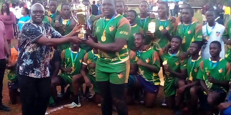 The Namilyango U17 team receiving their trophy at Makerere.