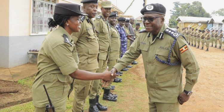 IGP Byakagaba greeting one of the women officers