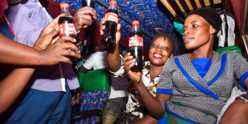 ‘Share a Coke’ Campaign: Passengers at Kisenyi Bus Terminal recieves a pleasant surprise 