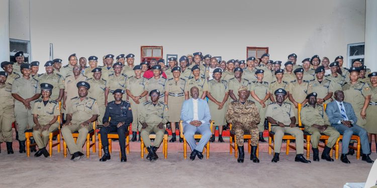 The state minister for Internal Affairs Gen. David Muhoozi (in suit) in posing for a photo with the IGP Abas Byakagaba and other senior police officers. Courtesy photos/by Police Press Unit
