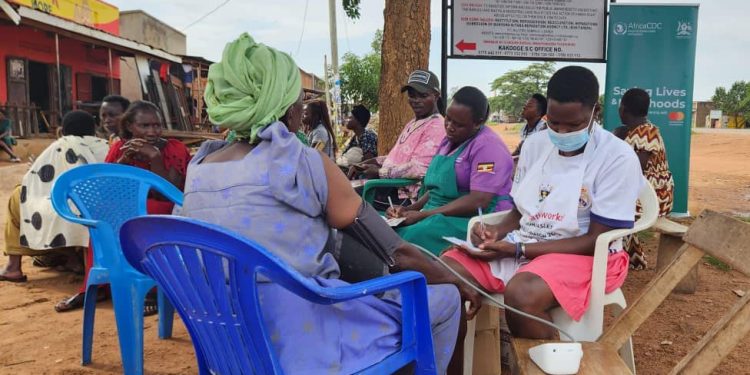 Residents from Katuugo, Kiralamba and other nearby villages gathered to recieve medical treatment, and advise from health workers during a community health outreach program in Katuugo Village, Nakasongola District