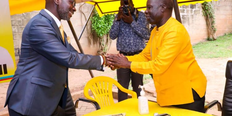 Hon. Hamson Obua (L) and NRM electoral commission chairperson Tanga Odoi (R)