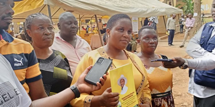 Rita-Namuwenge-speaks-to-the-press-shortly-after-picking-nomination-papers