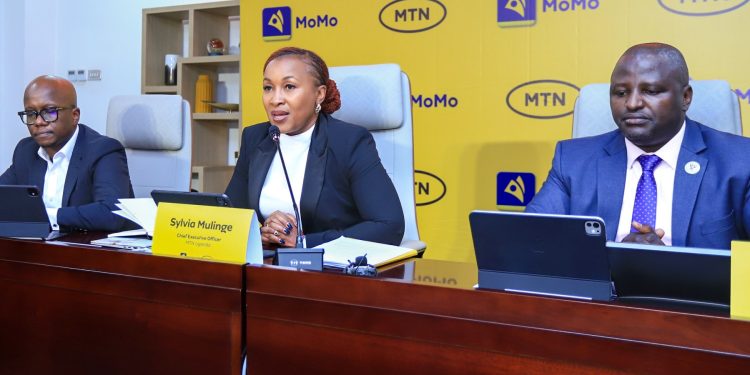 Sylvia Mulinge, Chief Executive Officer of MTN Uganda ( C)