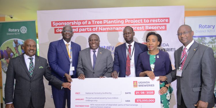 Left to Right: Emmanuel Katongole, Rotary International Director, Uganda Breweries Managing Director Andrew Kilonzo, Jimmy Mugerwa, the Uganda Breweries Board Chairman, Martin Mwodi Kegere, the Director Plantations Development at National Forest Authority (NFA), Christine Kyeyune Kawooya, District Governor of Rotary District 9214 and Governor of Rotary District 9213 Martin Kitakule during the announcement of the partnership to save Namananga Central Forest Reserve.