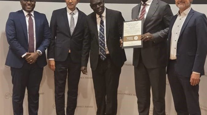 Julius Kakeeto (2nd R), PostBank Uganda Managing Director holding the Sustainability Certificate from EOSD, Peter Ssenyange (L), Chief Financial Officer, PostBank Uganda, Arshad Rab (2nd L), CEO of EOSD and Chairman of the Sustainability Standards and Certification Initiative, and other officials. This was in Germany last week, on 25th September 2025, when PostBank was being handed the Sustainability Certification by the European Organization for Sustainable Development (EOSD).