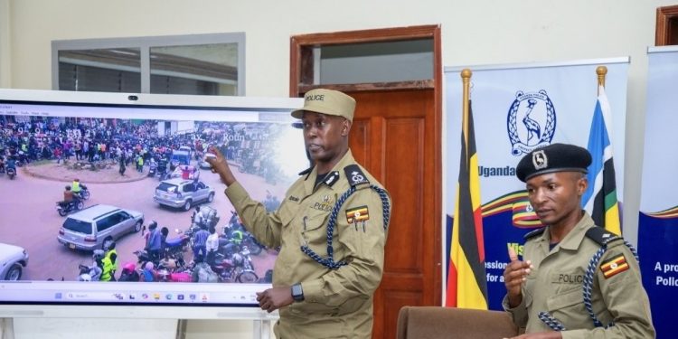 Kituuma showing off some of the recorded footage in regard to the accident. Ugnewsline Photo.