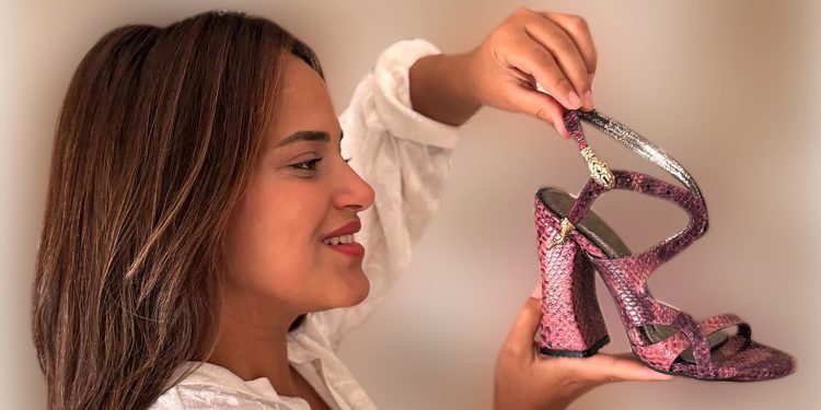 The Zahw – Serpent Sandal by Farida Eid: a masterpiece that bridges Egypt’s ancient heritage with modern luxury. Crafted in purple cowhide leather, detailed with copper serpent motifs, and set on hand-carved wooden heels, it embodies sovereignty, protection, strength, and timeless elegance. Her winning design is hailed as ‘a powerful demonstration of leather’s beauty, versatility, durability, and strength, qualities that define the leather industry’s relevance for the future.’ This creation crowned Farida as the Most Commendable Designer, RLSD Africa 2025, carrying Africa’s creative voice to the world stage.

Photo: FARIDA EID, 2025 Most Commendable Designer, RLSD Africa 2025