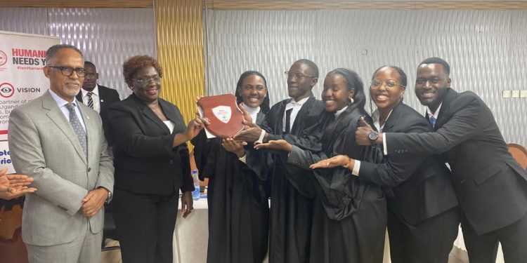 Uganda Christian University team while receiving award from Justice Susan Okalany and the organisers,ICRC