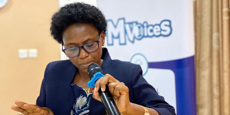 Dr. Irene Mwenyago, Assistant District Health Officer at the Ministry of Health while addressing participants during the M-Voice Summit at Eureka Hotel, Kampala Uganda.