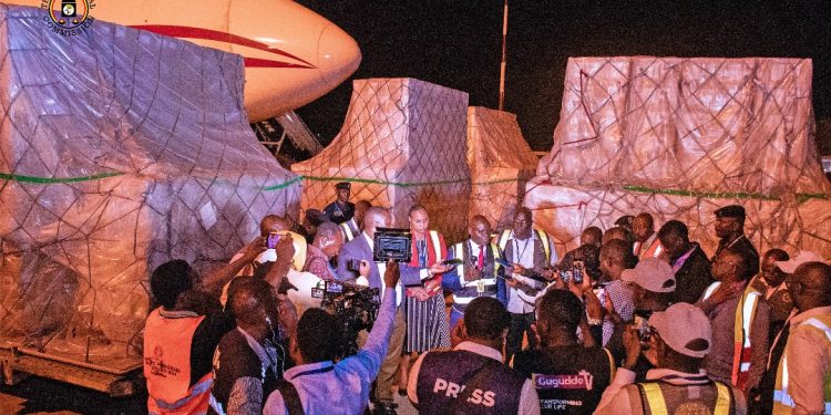 Byabakama addressing journalists at Entebbe Airport.