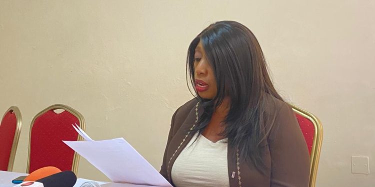 Dr. Nulu Nakabonge Kasasa reading the family protest letter during a press conference at Piato Restaurant in Kampala