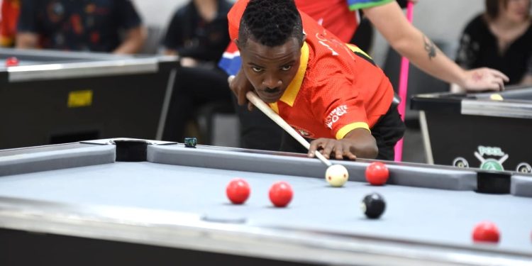 Ibra Sejjemba aims to pot the black.