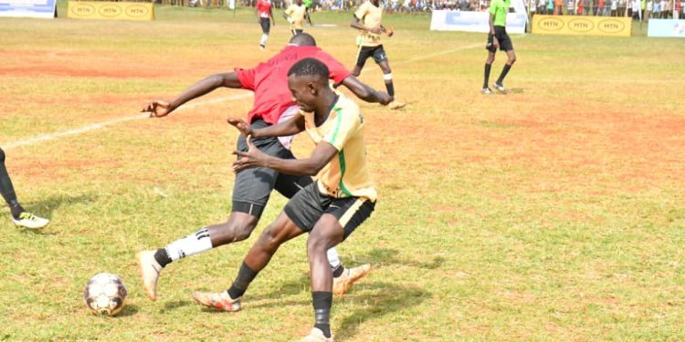 Luuka-in-Red-playing-against-Bugabula-in-cream-during-the-2nd-Semi-final-of-the-MTN-Busoga-Masaza-Cup-tournament-2025-at-Kyabazinga-stadium-Bugembe-in-Jinja-City.