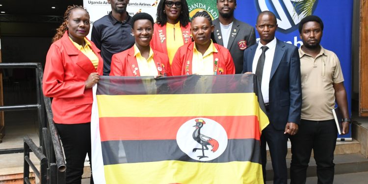 Rita Apell Akot (in glasses), posing for a photo with the team led by the Captain Peace Kabasweka(second-left) during the flag off event on Friday.