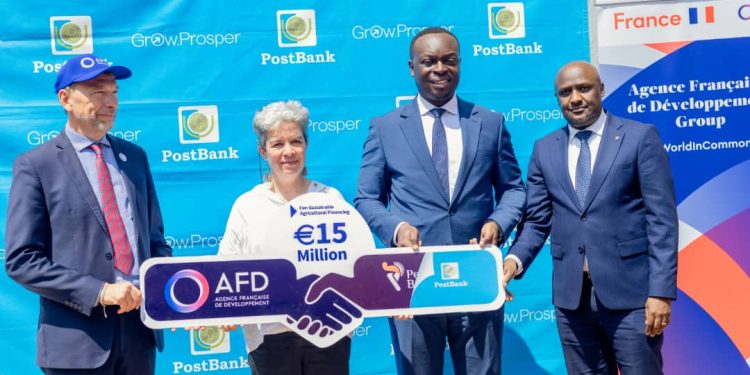 H.E. Virginie Leroy (C), Ambassador of France to Uganda, PostBank Uganda Managing Director Julius Kakeeto (L) Martin Mugisha, Executive Director, Operations (R), and Marc Trouyet, the Country Director for AFD in Uganda, during the announcement the Bank's partnership with Agence Française de Développement (AFD)