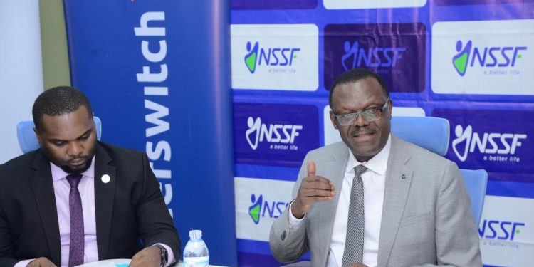 NSSF Managing Director Patrick Ayota(r) addresses the media during the launch of the NSSF Interswitch  Partnership in Kampala today