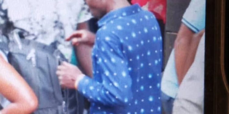 A suspected pickpocket was spotted stealthily attempting to snatch valuables from unsuspecting pedestrians.