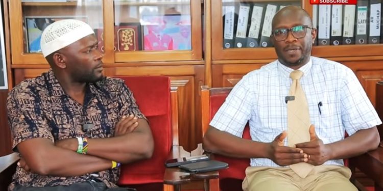 Journalist Farouk Sarkozy and Simon Peter Musoke, Head of Marture Department. UGNESWSLINE photo.