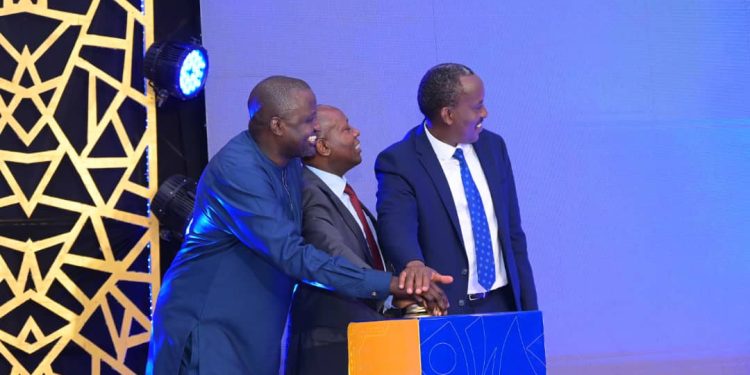MTN MoMo's Managing Director Richard Yego, Ag. Accountant General, Ministry of Finance, Godfrey Semugoma and John Musinguzi Rujoki, the URA Commissioner General, launching the enhanced services at the Sheraton