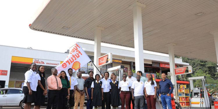 Joanita Mukasa Menya, Managing Director of Vivo Energy Uganda, and Alinafe Mkavea, Chief Commercial Officer of Vivo Energy Uganda (middle) pose for a group photo with other executives after flagging off Fuel their future campaign at Shell Lugogo