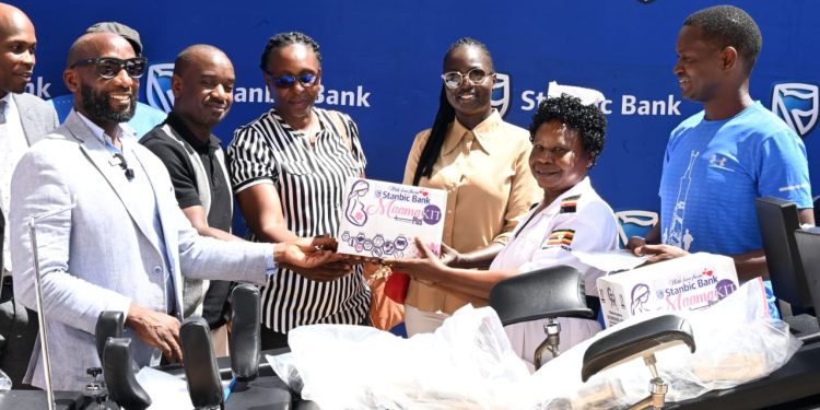 Stanbic Bank's Head of Affluent Banking Arthur Kiwanuka (left), Entebbe Golf Club's Captain Serwano Walusimbi (2nd left), handing over medical equipment to the staff of Entebbe Hospital.