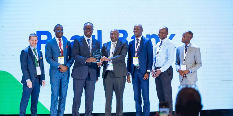 *Group Photo Aceli*

Julius Kakeeto (3rd L), Pearl Bank Uganda Managing Director, Martin Mugisha, Executive Director Operations at Pearl Bank (C), receiving the Best Agri-SME Lender Accolade at Aceli Africa Uganda Stakeholder Roundtable from Aceli Africa CEO, Brian Milder (L), Aceli Africa Country Director, John Robert Okware (2nd L).