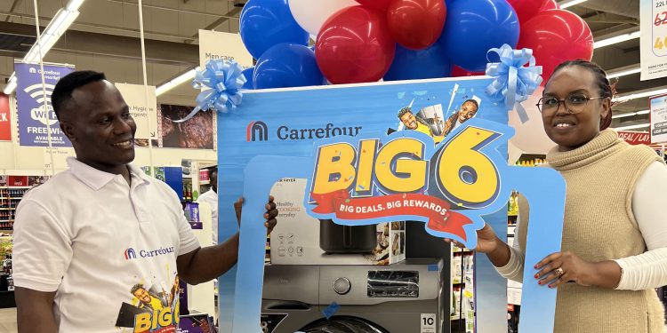 Ms.Beza Elyane recieves her Washing Machine from Carrefour after participating in the Carrefour 6th Anniversary Celebrations dubbed Big 6 promotion