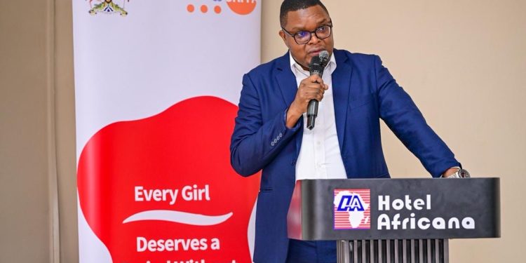 Hajj Aziz Mukota, Manager of Testing Services at UNBS, delivering his remarks at the Menstrual Hygiene Symposium.