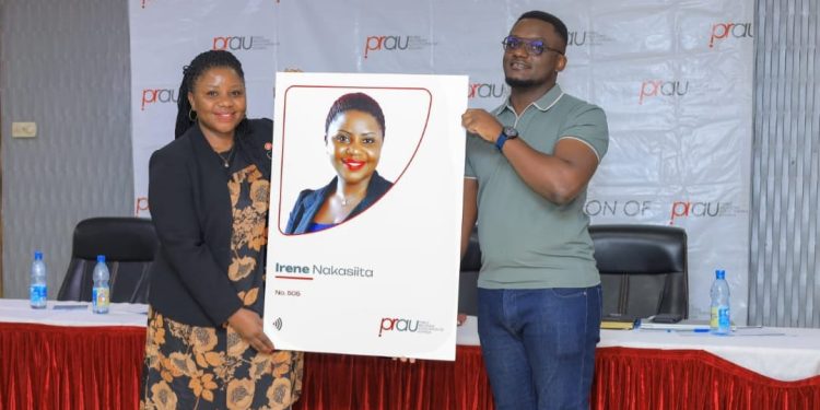 President Irene and CEO Mulwana
PRAU President Irene Nakasiita (L) receiving a replica of the Digital Membership IDs from Joshua Mulwana (R), C.E.O, Founder and Team Leader at Malticard at the 50th PRAU AGM held at Hotel Africana on 11th April 2026.