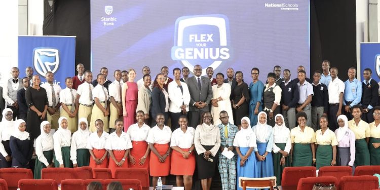 The Guest of honor Ms. Allen Kagina poses for a group photo with students and partners at the launch of the Stanbic Bank National Schools championships