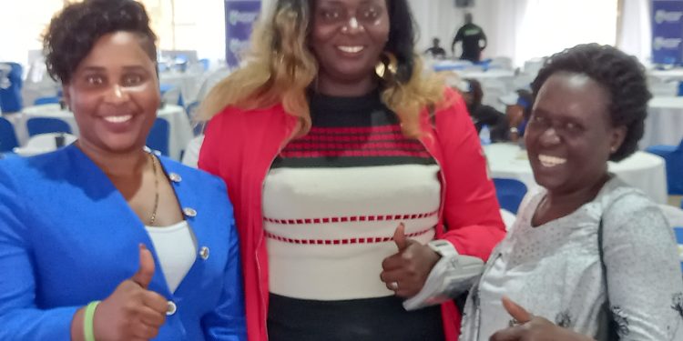 Union Uganda brand ambassador Alice Natukunda is flanked by Irene Kusiima and Nalubega Mastulah the chairperson of the Mbuya 11 Twekulakulanye group