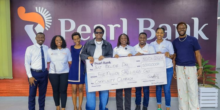 Pearl Bank’s Head of Marketing and Communications, Priscilla Akora (4th R), handing over a dummy cheque worth UGX 5 million to Joshua Baraka (4th L), a Ugandan celebrated artist, joined by other Pearl Bank staff. The bank's contribution aims to support the feeding of 1000 families in Kawempe, in line with the bank’s Humanitarian pillar, which is among Pearl Bank's Corporate Social Investment agenda