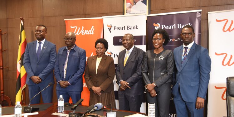 Hon. Matia Kasaija (C), The Minister of Finance, Planning and Economic Development (MoFPED), Evelyn Anite (2nd R), the State Minister for Investment and Privatization, Joseph Areu (2nd L) Pearl Bank, Non Executive Board Member, Julius Kakeeto (L), Pearl Bank Managing Director, and other Pearl Bank Board Member's during the Bank’s 2025 Annual General Meeting at the Ministry of Finance, Planning and Economic Development offices in Kampala on Tuesday, 05th May 2026. The Bank was applauded by Shareholders (MoFPED) for being a profitable, national, impact-led institution after recording a UGX 47 billion in PAT.