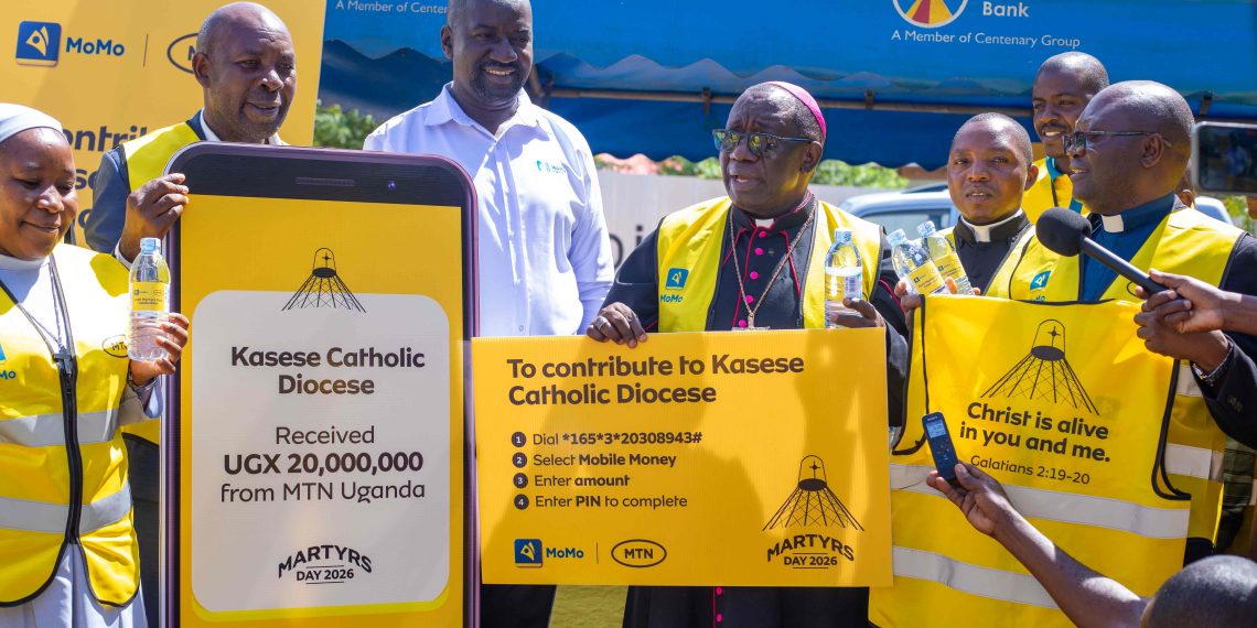 Rt. Rev. Francis Aquirinus Kibira, Bishop of Kasese Diocese, receives MTN Uganda’s UGX 20 million contribution from Andrew Tusubira, MTN’s Regional Commercial Head Western Region