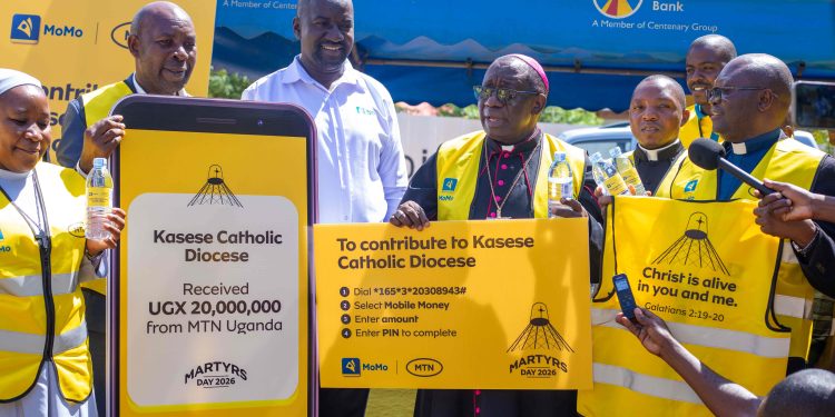 Rt. Rev. Francis Aquirinus Kibira, Bishop of Kasese Diocese, receives MTN Uganda’s UGX 20 million contribution from Andrew Tusubira, MTN’s Regional Commercial Head Western Region