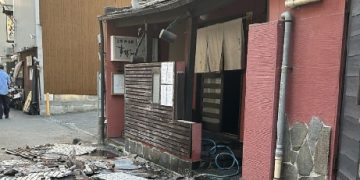 Death toll rises to 13 as rescuers battle to find survivors after Japan earthquake