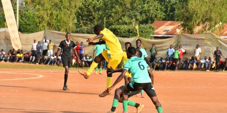 A-Bukono-player-rises-to-challenge-for-a-header-as-Budiope-defenders-close-in-during-a-competitive-encounter-that-finished-goalless