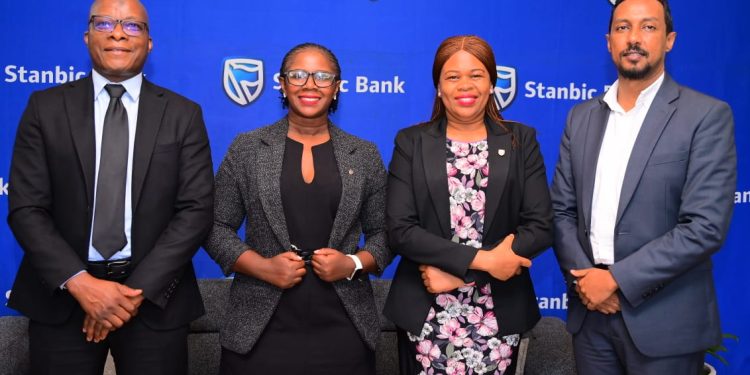 (L-R) Stanbic Bank's Ali Lwanga Head Sales, Syliva Atuhairwe Head Distribution, Yvonne Namutosi Manager Digital and E-Commerce and Dogo Singh Manager Insurance